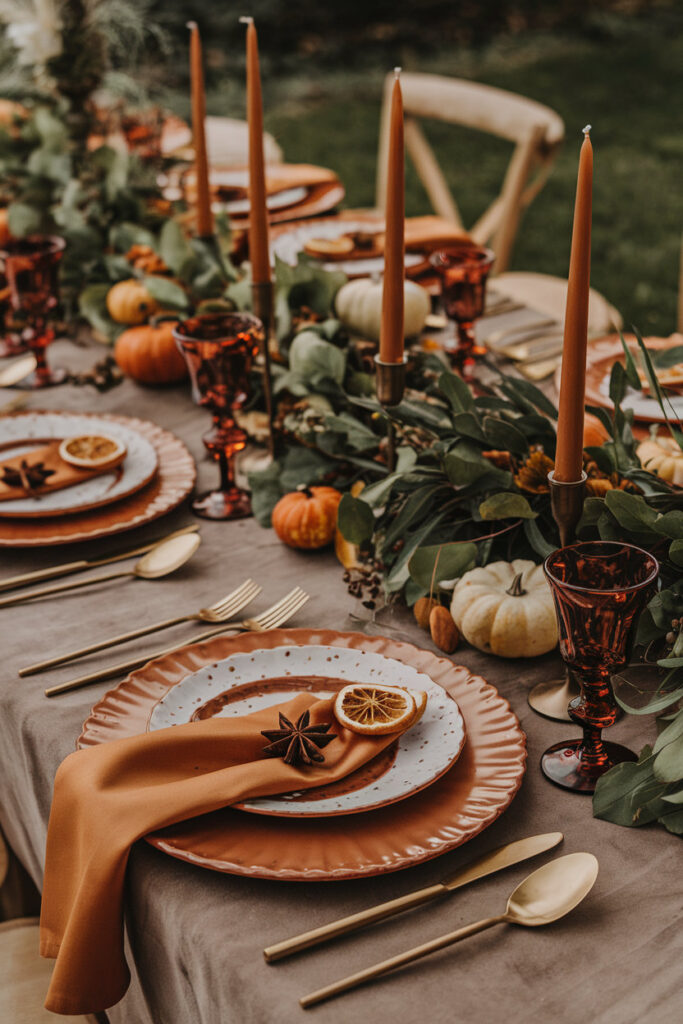 Thanksgiving table setting featuring bold jewel tones and sophisticated details.

